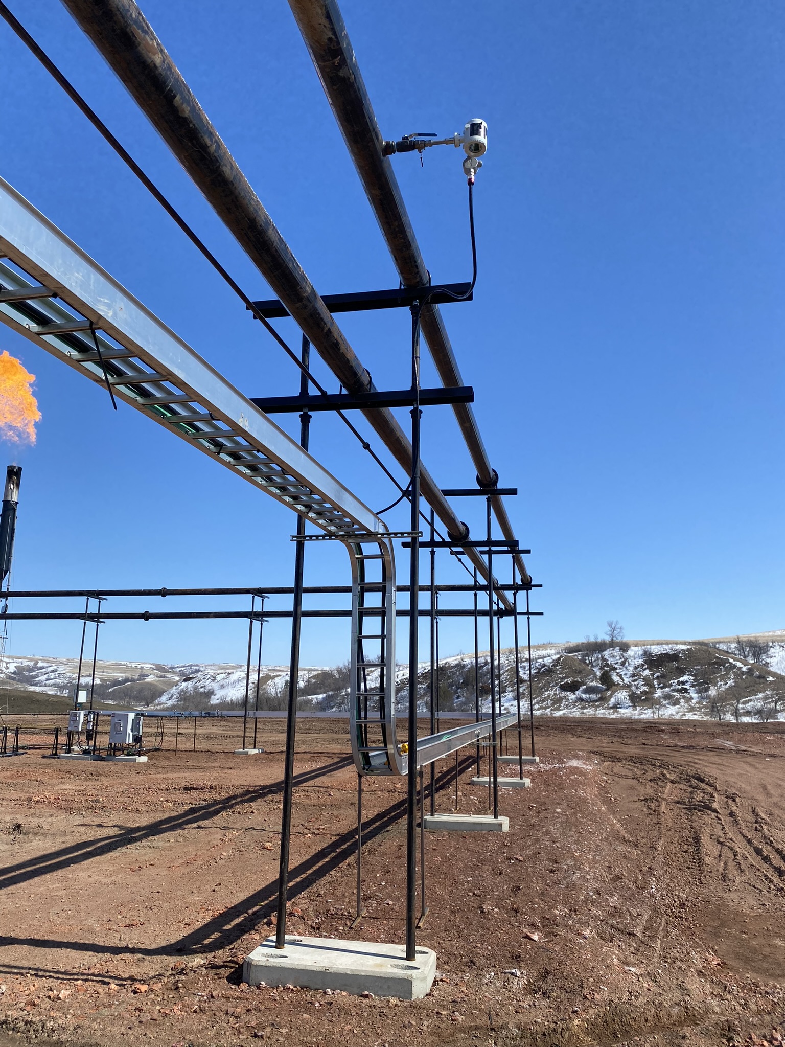 Steffes Oil and Gas pipe stands support pipes on a well site