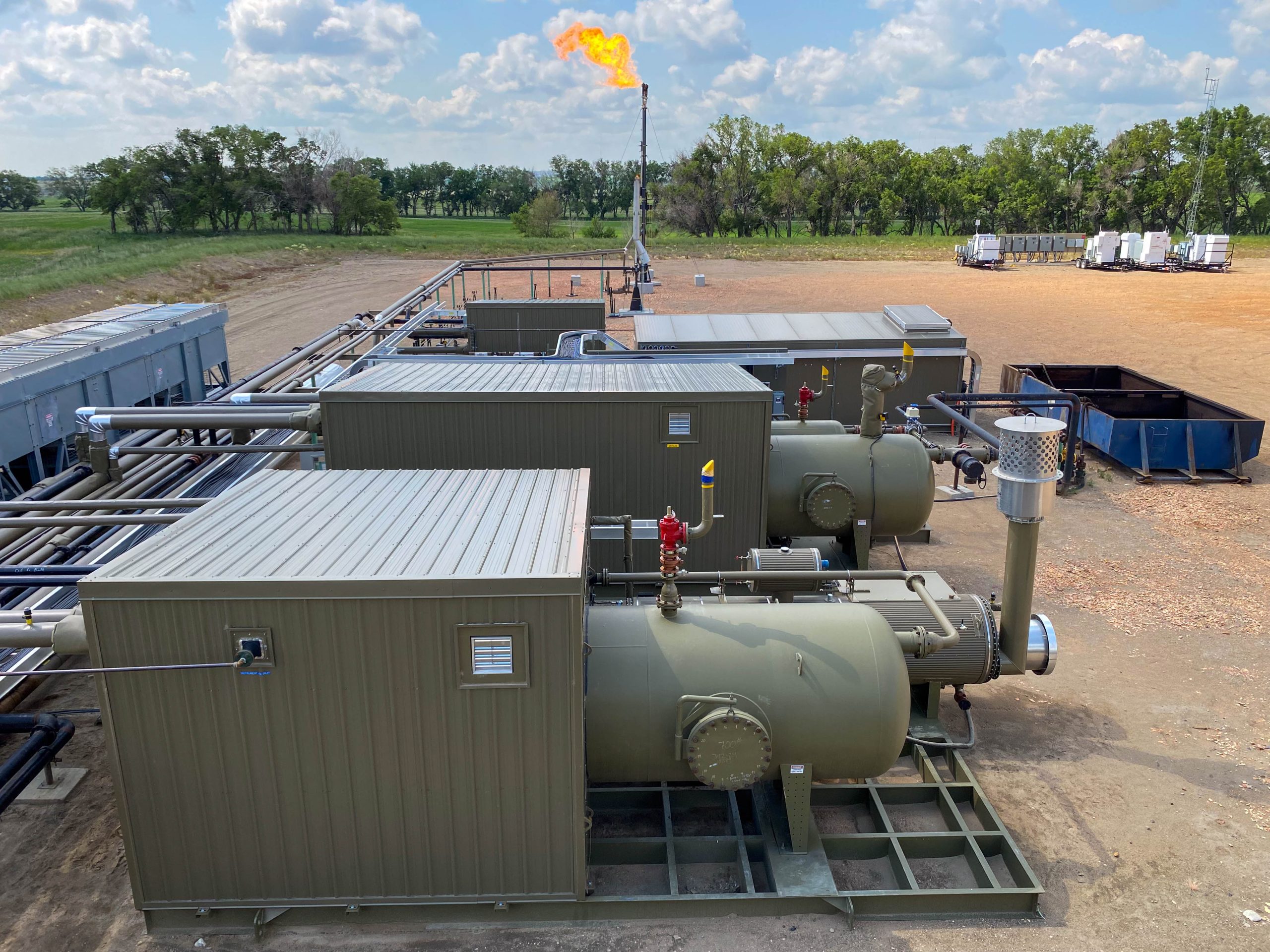 Steffes's custom production equipment operates seamlessly on a well site during the summer.